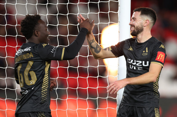 A-League All Stars celebrate a goal.