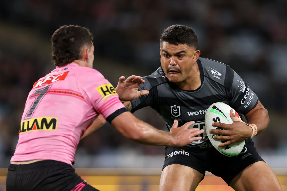 Latrell Mitchell swats Nathan Cleary away.