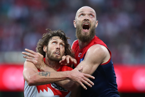 Sydney’s Tom Hickey and Melbourne’s Max Gawn only have eyes for the Sherrin.