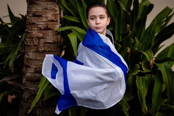 Ben Carasso, 11, poses for a portrait as people gather at Bondi Pavilion to commemorate the three-year anniversary of the October 7th attack on Israel.