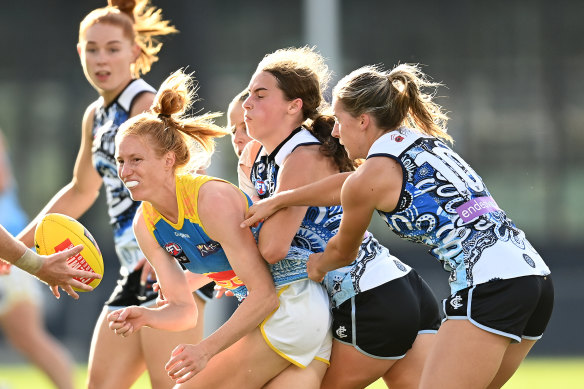 Blues brigade: Alison Drennan, centre, is tackled. 