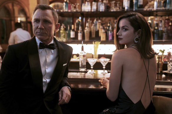 Daniel Craig, left, with Ana de Armas in the Alexandra dress by Sydney designer Michael Lo Sordo.
