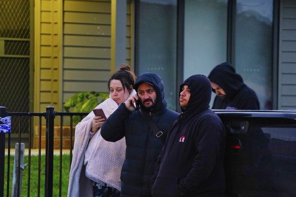 Loved ones are seen outside the home where two men, a woman and a teenage boy died in Broadmeadows overnight.