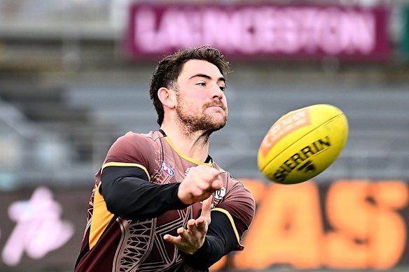 Jai Newcombe of the Hawks warms up.