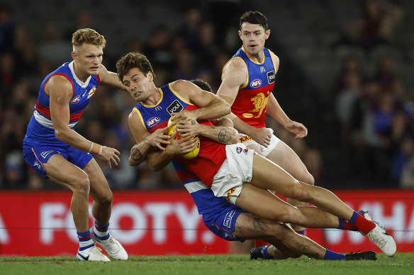 Josh Dunkley, tackled by the Bulldogs’ Tom Liberatore, was jeered all night by the home fans on his first appearance against his former team.