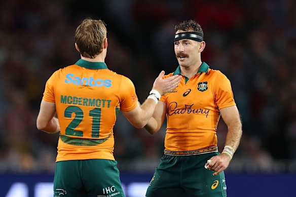 Nic White from Wallabies embraces his teammate Tate Mcdermott.