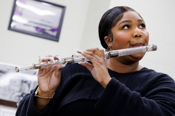 Lizzo plays a flute that belonged to US president James Madison at the Library of Congress.