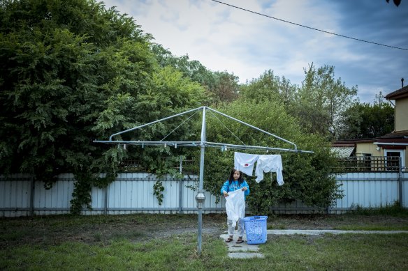 Lah Bwe Say Paul hangs out the washing at home in Ararat.