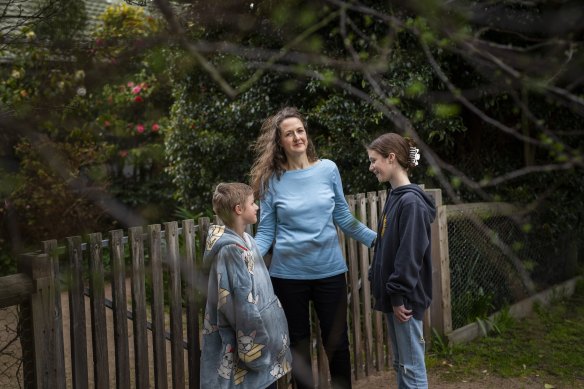 Claire Harvey, with and her two children Micha, 9, and Sarah, 12, says taking some action, any action, on climate change helps reduce her feelings of powerlessness in the face of a global crisis. 