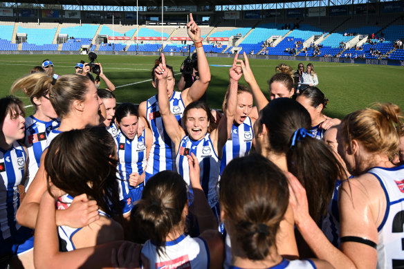 Ash Riddell and the Roos celebrate their wins.