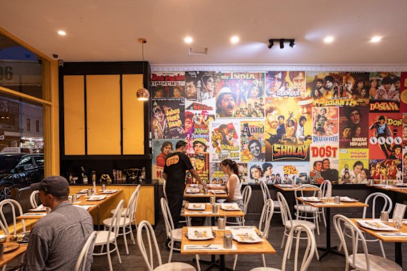 Bollywood movie posters decorate Bombay Meri Jaan's wall.