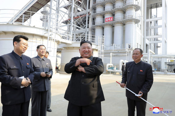 Kim Jong-un, centre, visits a fertiliser factory in South Pyongan, near Pyongyang, North Korea, on Friday.