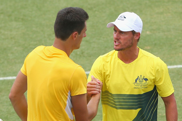 Lleyton Hewitt mentoring Tomic through the 2016 Davis Cup tie against the United States in Melbourne.