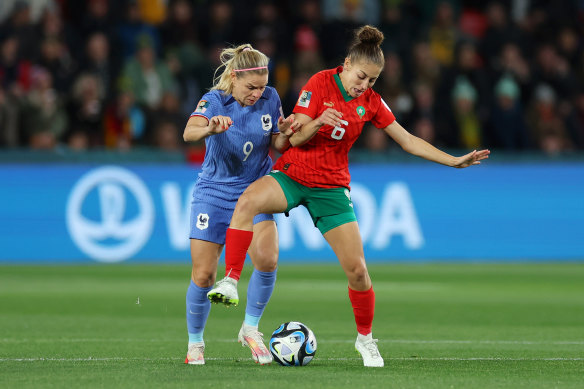 France’s Eugenie Le Sommer battles Morocco’s Elodie Nakkach for the ball.