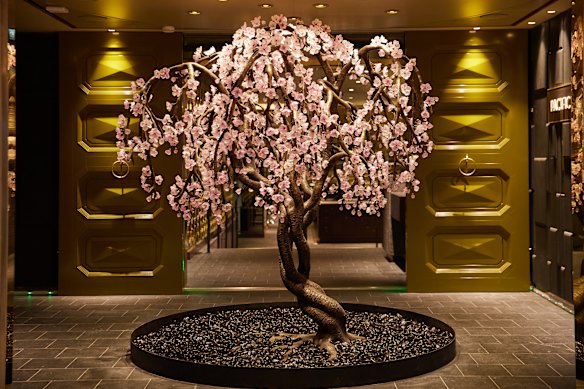The art collection includes a life-sized glass cherry blossom tree.