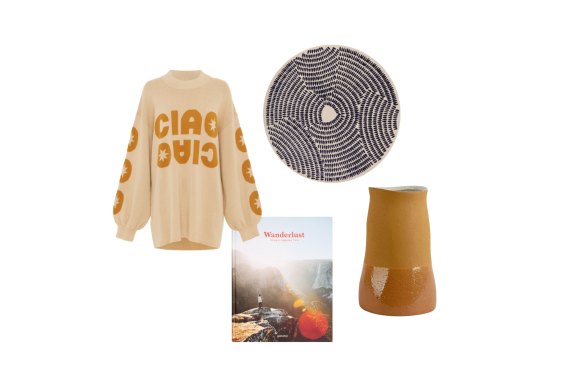 “Kora” sweater; Wanderlust: Hiking on Legendary Trail; “Calendar Stone” rug; “Sally” vase.