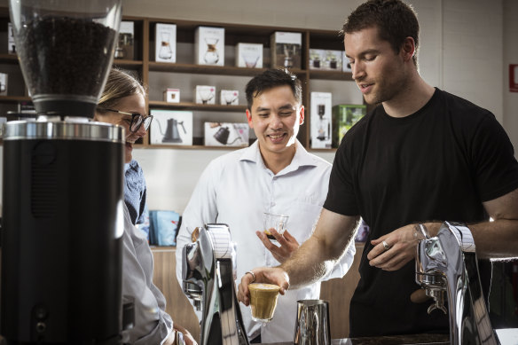 Head barista Matt Coulson talks customers through making their own coffee.