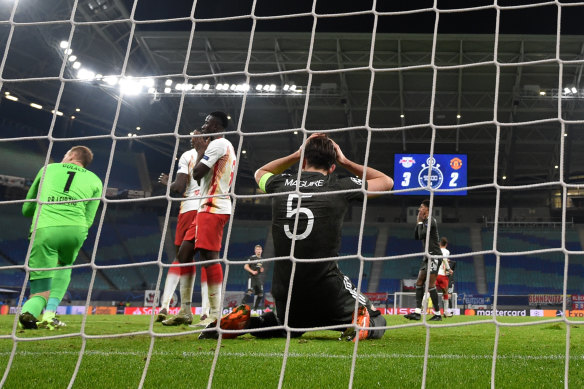 Manchester United's Harry Maguire reacts after missing a goal chance against RB Leipzig.