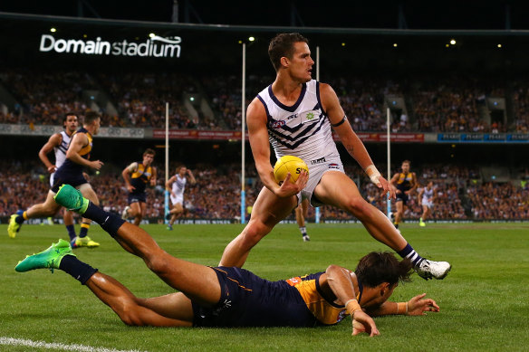 Balic sidesteps Sharrod Wellingham in a western derby in 2017.