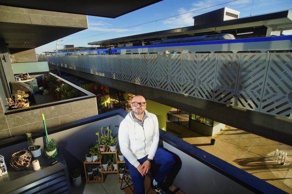 Goran Torbakov at his apartment, overlooking the new station.