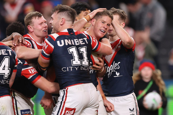 The Roosters celebrate an Egan Butcher try.