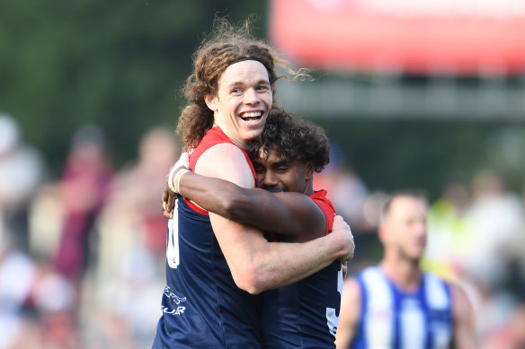 Ben Brown hugs Kysaiah Pickett.