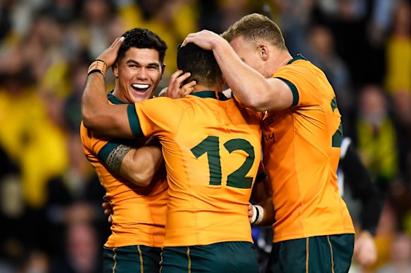 Noah Lolesio celebrates after scoring a try at Suncorp Stadium.