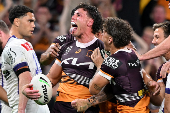 Broncos forward Jordan Riki celebrates his try.