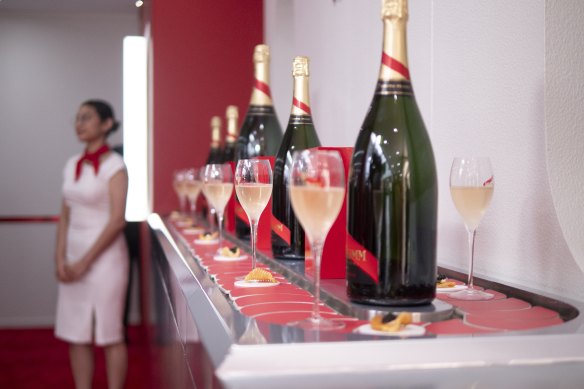 Mumm’s marquee in the Birdcage included a conveyer belt of champagne.