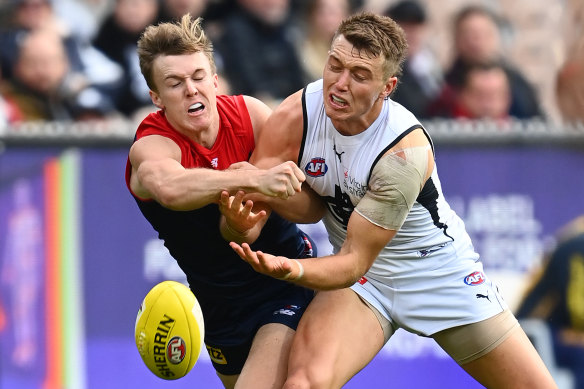 James Jordan, left, and Patrick Cripps, right, in action on Sunday. 