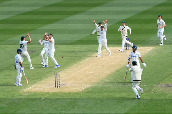 Australia celebrate Jaiswal’s runout.