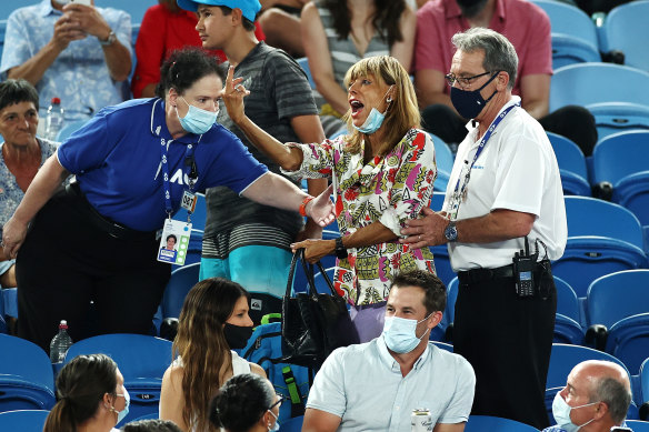 Security officials ask the spectator to leave the stadium during Nadal’s match against Mmoh.