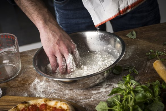 Mixing the flour and water in the quest for the perfect pizza dough.