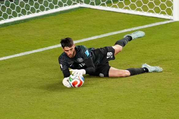 Patrick Beach makes a save against Paraguay.