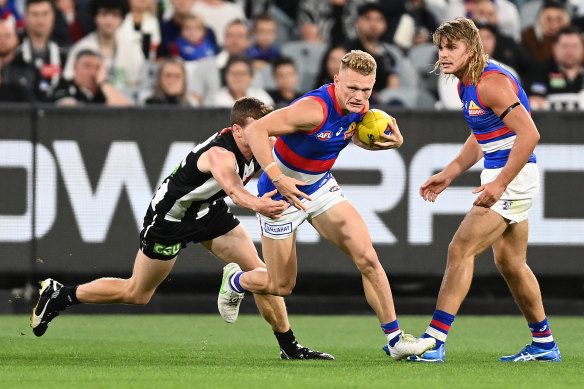 Adam Treloar on the run for the Bulldogs in their win over Collingwood on Friday night.