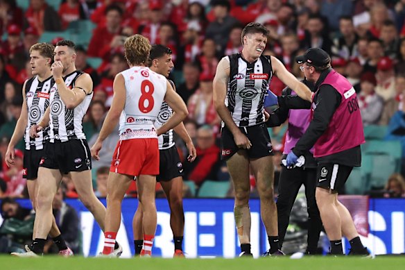 Oscar Steene was assisted by medical staff before leaving the field.