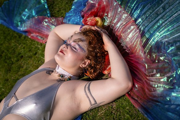 India Wade, a senior at Northwestern, rests in between headliners during an end of school year festival.