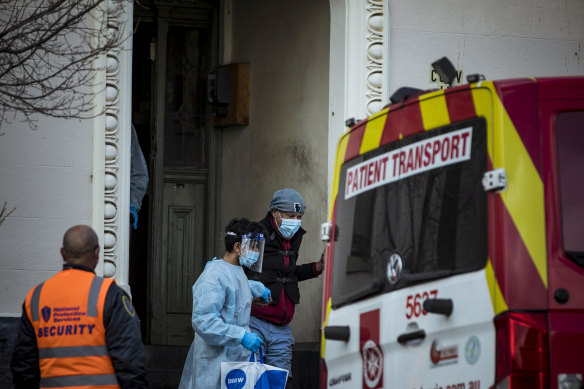 Residents of Hambleton House, Albert Park are picked up by Ambulance staff and moved to another facility. Hambleton House is currently under lockdown after a COVID-19 outbreak. 