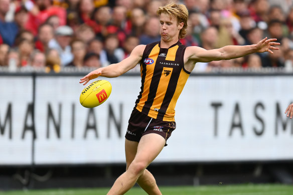 Cam Mackenzie of the Hawks kicks during the round one AFL match between Hawthorn Hawks and Essendon Bombers at Melbourne Cricket Ground, on March 19, 2023, in Melbourne, Australia.