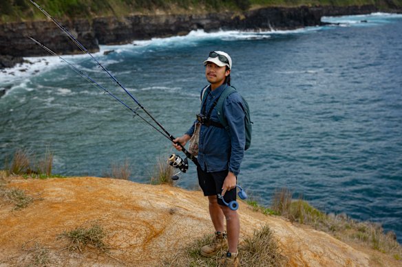 Tien Dat Do poses for a portrait near Headstone Point on Norfolk Island.