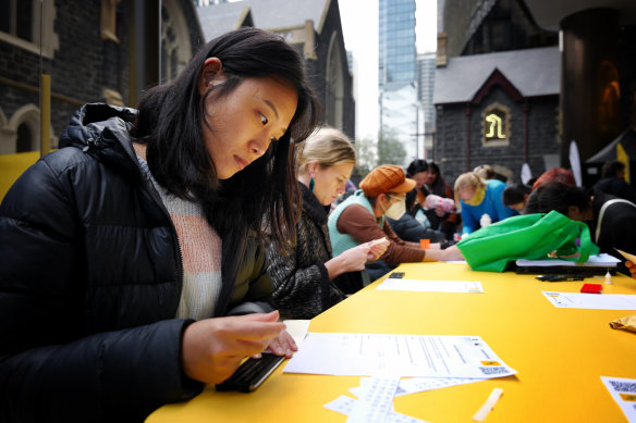 Braille bombers prepare their signeage.