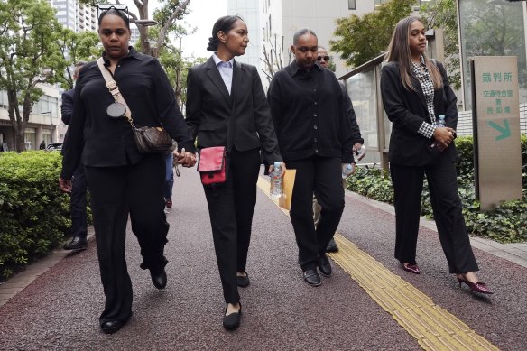 Family members of Australian citizen Donna Nelson head to the Chiba District Court on the opening day of the trial.