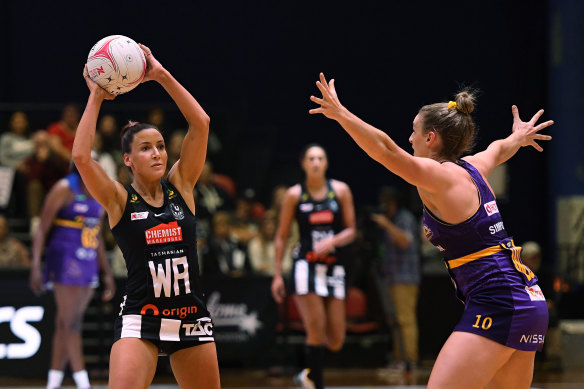 Magpie Kelsey Browne, left, looks to pass during round four against the Firebirds. 