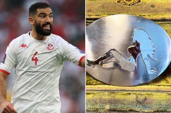 Yassine Meriah of Tunisia during the FIFA World Cup Qatar 2022 Group D match between Denmark and Tunisia in the Kappa jersey and The Mudflap Girl silhouette on a vintage belt buckle. 