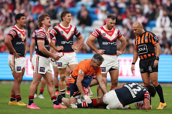 Siua Wong is injured in the first half.