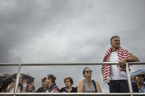 James Sepsakos, 51, standing, prepares to swim in Blessing of the Waters for the first time. Next to him is wife Stacey.