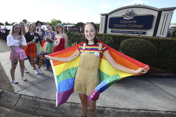 Former Citipointe Christian College student Felicity Myers outside the school with protesters in January 2022.