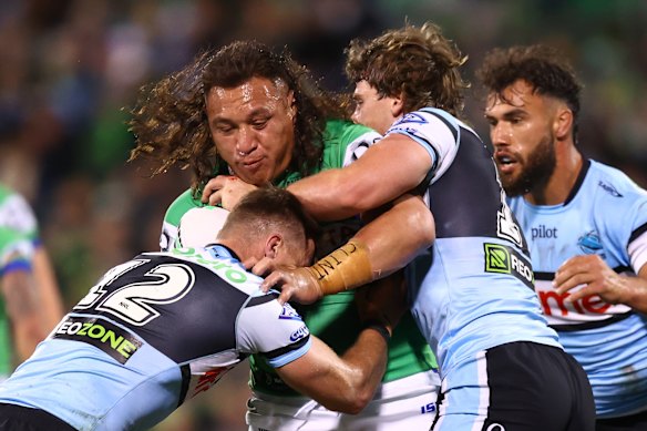 Josh Papali’i of the Raiders is tackled. 