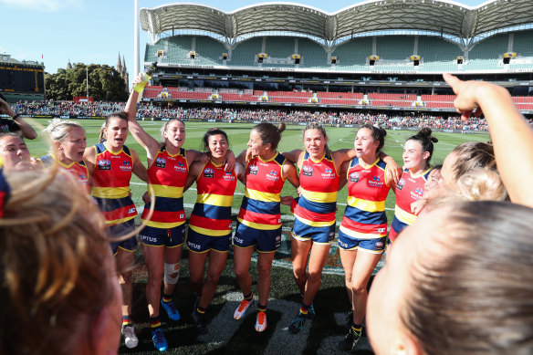 Back in the grand final again: Adelaide players celebrate their victory in the preliiminary final against Melbourne. 