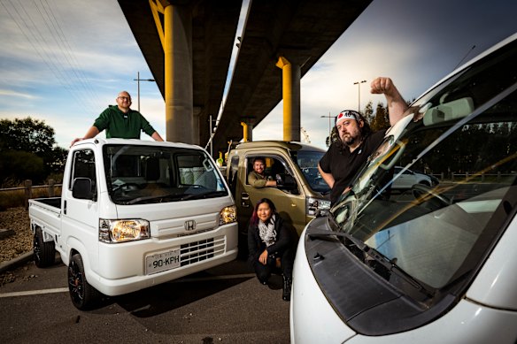 Kei truck owners (from left) Gregory MacCallum-Le, Stephen Mason, Jean Darling (crouching) and Jason O’Callaghan.
